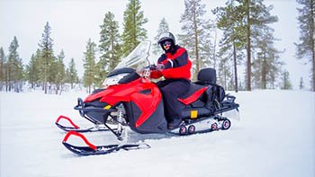 a-man-on-snowmobile-in-winter-mountain-2026-03-17-07-15-47-utc