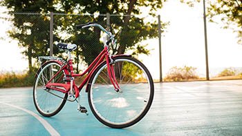 close-up-photo-of-red-classic-bicycle-standing-on-2026-03-10-02-07-12-utc