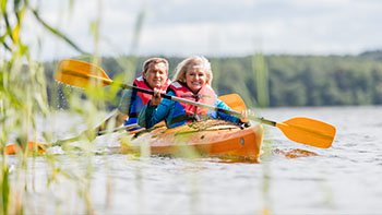 happy-senior-active-couple-kayaking-on-lake-2026-01-09-07-43-02-utc
