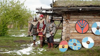 reenacting-medieval-warriors-outside-wooden-hut-2026-01-09-00-52-08-utc