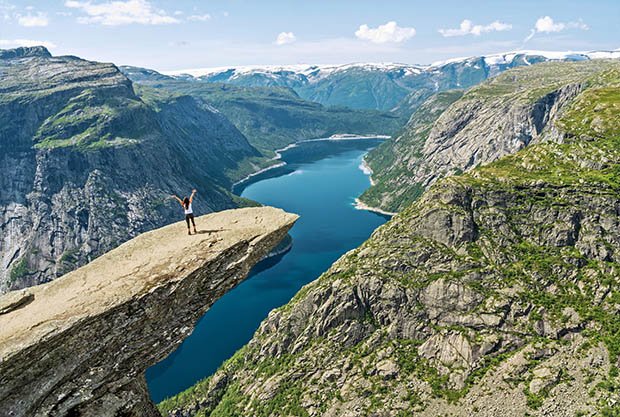 trolltunga-rock-ringedalsvatnet-mountain-lake-famous-norwegian-hiking-tourist-landmark-with-girl-standing-rock-norway