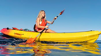 young-beautiful-woman-traveling-by-canoe